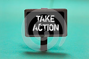 Text sign showing Take Action. Conceptual photo advices someone to do something or reaction right now Blackboard green background