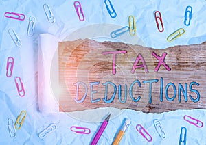 Text sign showing Tax Deductions. Conceptual photo amount or cost that can be subtracted from someone s is income Stationary and