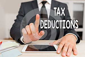 Text sign showing Tax Deductions. Conceptual photo an amount or cost that subtracted from someone s is income.