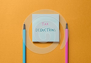 Text sign showing Tax Deductions. Conceptual photo an amount or cost that subtracted from someone s is income Front view