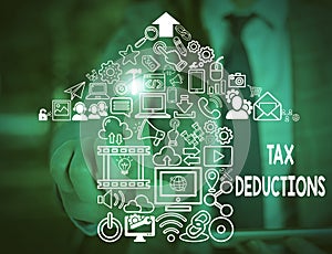 Text sign showing Tax Deductions. Conceptual photo an amount or cost that subtracted from someone s is income Woman wear