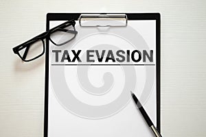 Text sign showing Tax Evasion