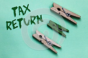 Text sign showing Tax Return. Conceptual photo which taxpayer makes annual statement of income circumstances Three brown green vin