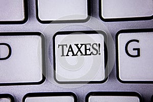 Text sign showing Taxes Motivational Call. Conceptual photo Money demanded by a government for its support written on White Keyboa