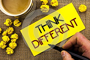 Text sign showing Think Different. Conceptual photo Rethink Change on vision Acquire New Ideas Innovate written on Sticky Note Pap