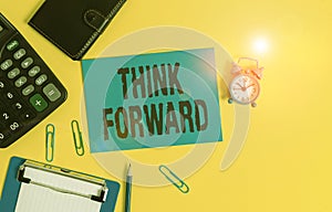 Text sign showing Think Forward. Conceptual photo The act of thinking about and planning for the future Clipboard clips sheet