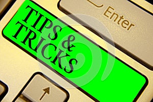 Text sign showing Tips and Tricks. Conceptual photo Steps Lifehacks Handy advice Recommendations Skills Keyboard green key Intenti photo