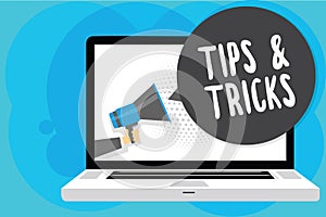 Text sign showing Tips and Tricks. Conceptual photo Steps Lifehacks Handy advice Recommendations Skills Man holding photo