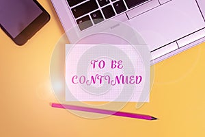 Text sign showing To Be Continued. Conceptual photo indicate that the story continues in the next episode Metallic laptop pencil