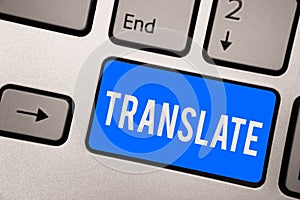 Text sign showing Translate. Conceptual photo Another word with same equivalent meaning of a target language Keyboard blue key Int photo