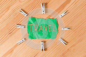 Text sign showing Travel. Conceptual photo the movement of showing between distant geographical locations Colored clothespin