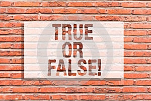 Text sign showing True Or False. Conceptual photo Decide between a fact or telling a lie Doubt confusion Brick Wall art