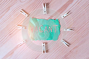 Text sign showing Vacant. Conceptual photo lacking contents which could or should be present Empty Not filled Colored clothespin