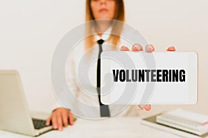 Text sign showing Volunteering. Business showcase Provide services for no financial gain Willingly Oblige Intern