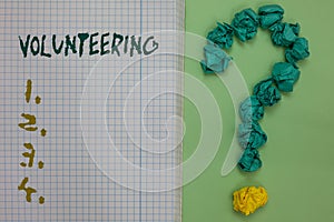 Text sign showing Volunteering. Conceptual photo Provide services for no financial gain Willingly Oblige Notebook paper crumpled p