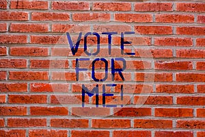 Text sign showing Vote For Me. Conceptual photo Campaigning for a government position in the upcoming election Brick