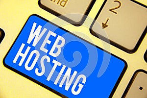 Text sign showing Web Hosting. Conceptual photo The activity of providing storage space and access for websites Keyboard blue key