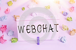 Text sign showing Webchat. Conceptual photo system that allows users to communicate in real time using internet Colored crumpled