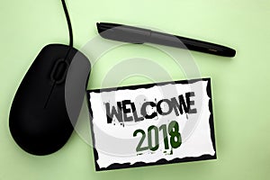 Text sign showing Welcome 2018. Conceptual photo Celebration New Celebrate Future Wishes Gratifying Wish written on Sticky Note Pa photo