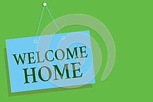 Text sign showing Welcome Home. Conceptual photo Expression Greetings New Owners Domicile Doormat Entry Blue board wall message co photo