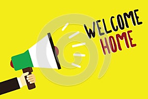 Text sign showing Welcome Home. Conceptual photo Expression Greetings New Owners Domicile Doormat Entry Man holding photo