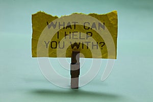 Text sign showing What Can I Help You With question. Conceptual photo Offering assistance Experts advice ideas Paperclip hold torn