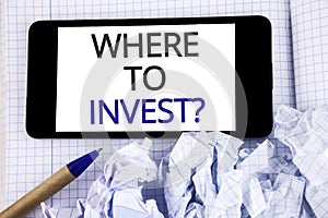 Text sign showing Where To Invest Question. Conceptual photo Right Place Stock Share to spend your savings in written on Mobile Ph