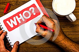 Text sign showing Who Question. Conceptual photo Asking for specific name of someone people personality Cup marker red pen notepad