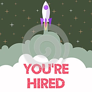 Text sign showing You Re Hired. Business approach New Job Employed Newbie Enlisted Accepted Recruited Rocket Ship