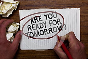 Text sign showing Are You Ready For Tomorrow question. Conceptual photo Preparation to the future Motivation Hand hold paper lob a