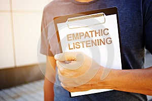 Text sign showing hand writing words Empathic Listening photo
