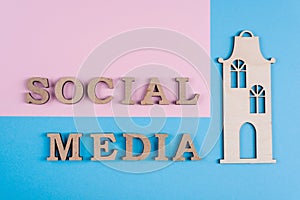 Text social media abstract wooden letters. Blue background with house.