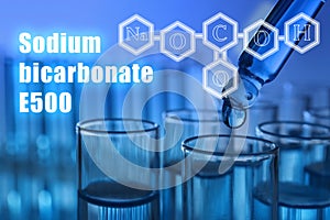 Text Sodium bicarbonate E500 with soda formula and test tubes