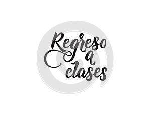 Text in Spanish: Back to school. calligraphy vector illustration. Regreso a clases