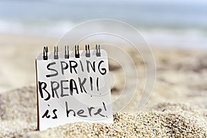 Text spring break is here in a notepad