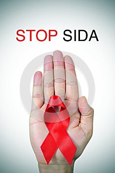 Text stop SIDA, stop AIDS in spanish, french or portuguese, and photo