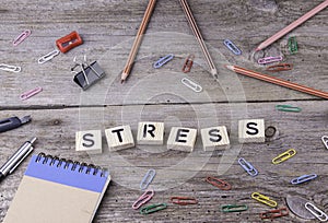 Text: Stress from wooden letters on wooden background