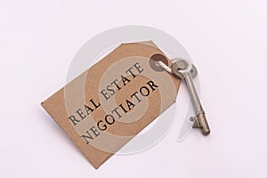 Text on a tag with key - Real estate negotiator