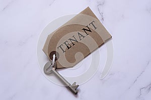 Text on a tag with key on white background