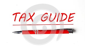 Text TAX GUIDE with ped pen on the white background