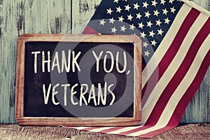 Text thank you veterans in a chalkboard and the flag of the US