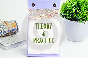 Text of Theory and Practice on a desktop calendar on a white background