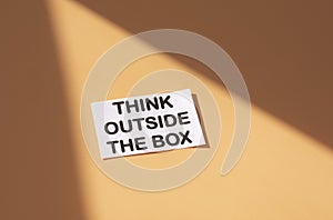 The text think outside the box . Business motivational inspirational concept