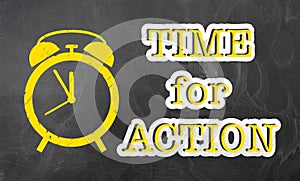Text TIME FOR ACTION on blackboard with alarm clock icon