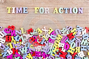 Text `Time for action` of colored wooden letters