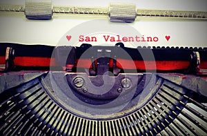 Text by typewriter Saint Valentine and red hearts with vintage t photo