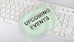 Text Upcoming Events on envelope on keyboard on the white background