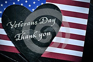 Text veterans day, thank you and the flag of the US