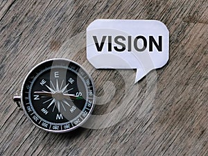 Text VISION written on bubble speech with compass.