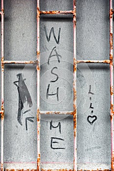 Text Wash me on inwashed and dirty glass